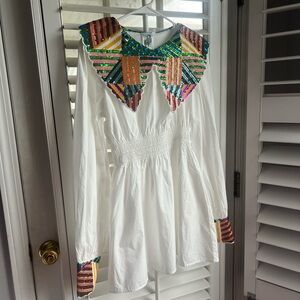 Queen of Sparkles white long sleeve mini dress with multi color sequin detailing